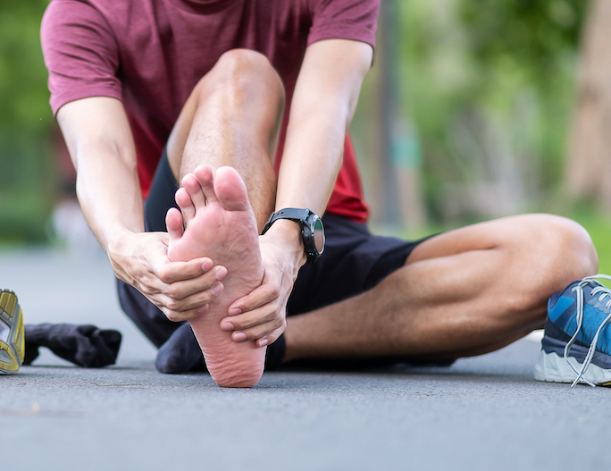 athlete man suffer from foot plantar fasciitis