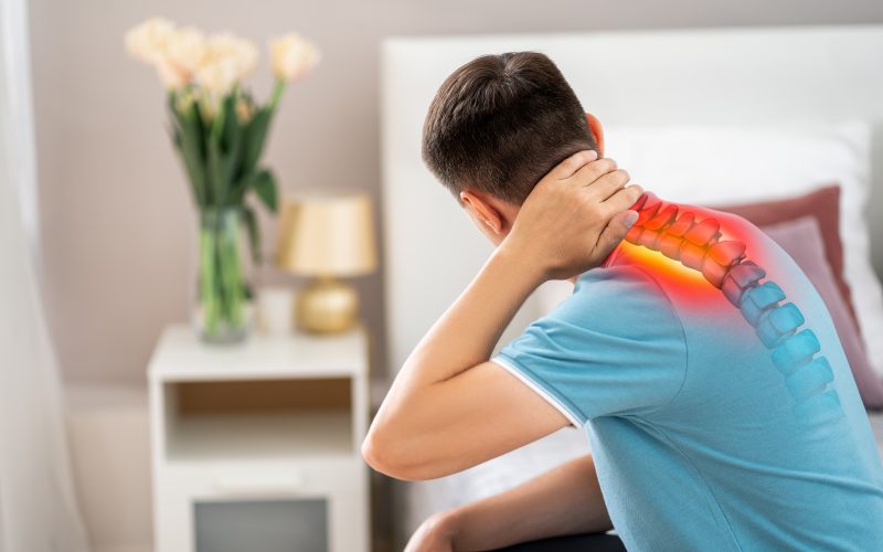 man touching neck pain point